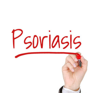 the word psoriasis written in red pen