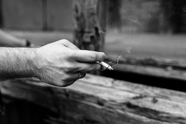 man with cigarette in hand